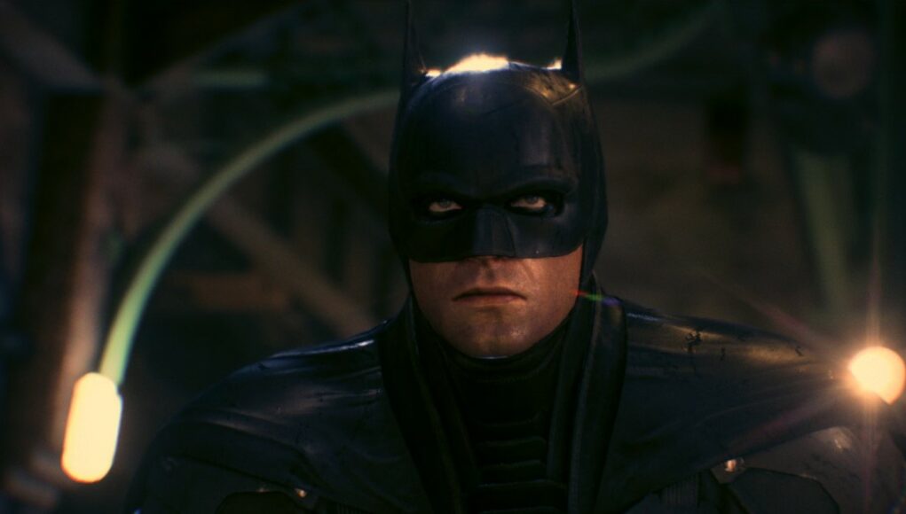 Batman tuijottaa synkästi kameran ohi.