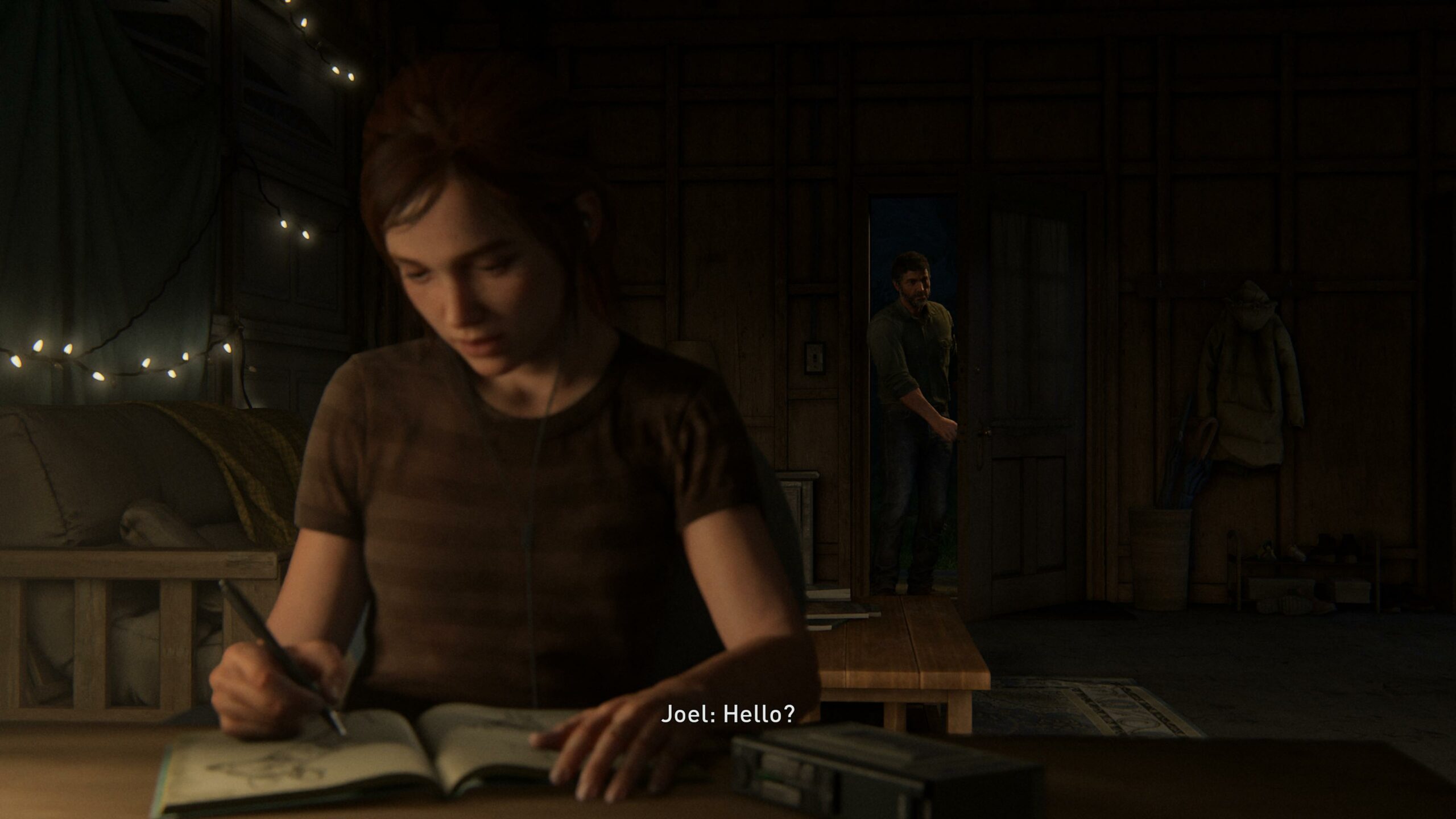 Ellie kirjoittaa päiväkirjaa ja Joel saapuu huoneeseen.