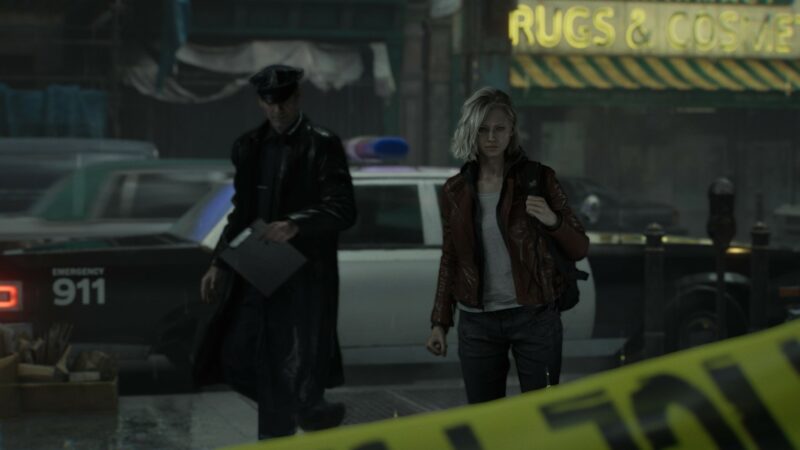 Grace lähestyy rikospaikkaa. Taustalla näkyy poliisi ja poliisiauto.