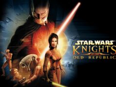 Saber vakuuttaa: Star Wars: Knights of the Old Republic on edelleen tuotannossa Star Wars: Knights of the Old Republic -videopelin kansikuva. Kuvassa on useita pelin hahmoja mustalla pohjalla. Keskellä seisoo Bastila Shan pitelemässä keltaista valomiekkaa, ja hänen takanaan kohoaa suurikokoinen, pelottava Darth Malak punaisessa asussaan. Vasemmalla puolella näkyy ryhmä muita hahmoja, kuten droidit HK-47 ja T3-M4 sekä ithorian-lajin edustaja. Oikealla puolella on pelin logo kultaisilla kirjaimilla ja taustalla näkyy taisteluplaneettoja ja avaruusaluksia.