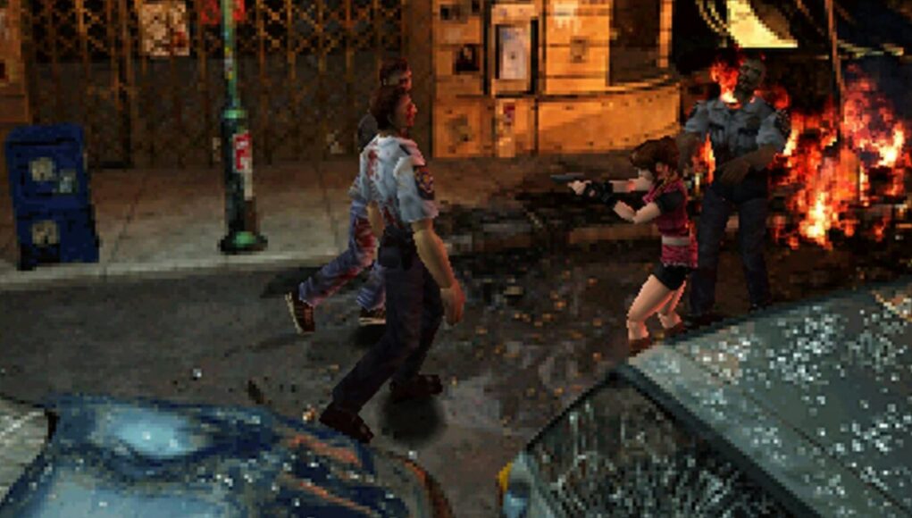 resident-evil-2-orig Pelinäkymä klassisesta selviytymiskauhupelistä, jossa Claire Redfield tähtää pistoolilla kohti lähestyviä zombeja öisellä kaupungin kadulla. Kadulla on roskia ja särkynyt auton ikkuna, ja taustalla näkyy tulipalo sekä zombi, jolla on poliisivirkapuku. Pelin grafiikka on tyyliltään pikselöityä ja peräisin 1990-luvun lopulta.