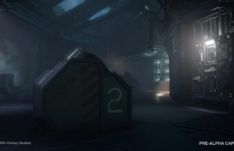Alien Isolation 2:sta julkaistiin varsinaista pelikuvaa – peli on juuri sitä mitä fanit ovat toivoneet Hämärä ja teollinen tieteiselokuvan tai -pelin ympäristö, jossa etualalla on suuri metallinen laatikko numerolla kaksi ja taustalla näkyy tietokonepaneeleita, kirkas valonlähde sekä kyltti tekstillä "EVAC".