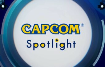 Capcom esittelee tulevia pelejään tällä viikolla Grafiikka, jossa lukee keskellä kelta-sinisin kirjaimin "CAPCOM Spotlight" valkoisessa ympyrässä, jota ympäröivät siniset, abstraktit muodot ja valonheittimet.