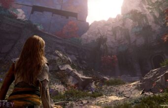 Seuraavaa God of War -peliä ei tähditä enää Kratos – pelistä julkaistiin 20-minuuttinen esittelyvideo Pelinäkymä kolmannen persoonan toimintaseikkailupelistä, jossa pitkähiuksinen naishahmo on kuvattu takaapäin selin kameraan. Hahmo katsoo kohti muinaisia, raunioituneita rakenteita ja vehreää kalliomaisemaa, jossa kasvaa köynnöksiä sekä punaisia ja valkoisia kukkia. Vasemmalla ylhäällä kohoaa valtava, sinertävä ja kuvioitu kiviseinä tai monumentti, ja oikealla puolella kalliossa näkyy holvimainen oviaukko. Aurinko paistaa kirkkaasti kukkuloiden takaa luoden vastavalofon. Ruudun vasemmassa alakulmassa näkyy pelin tyylitelty logo "GOD OF WAR LAUFEY" ja oikeassa alakulmassa teksti "Captured On PS5® Pro".
