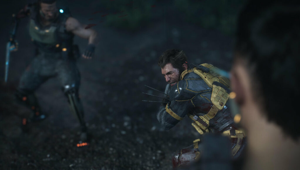 marvels-wolverine-valokuvatila Pelin valokuvatilan otos taistelutilanteesta, jossa haavoittunut Wolverine kyykkii valmiudessa kynnet esillä hämärässä maastossa vastustajan edessä.