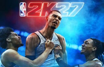 NBA 2K27 -arvostelu – Pallo pussiin! NBA 2K27 -pelin kansikuva tai promokuva, jossa Victor Wembanyama juhlii keskellä joukkuetovereiden ympäröimänä taustallaan sinipunanen valaistus ja iso 2K27-logo.